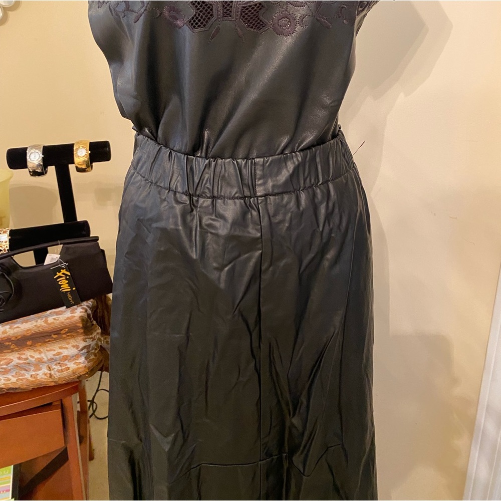 Faux leather skirt. Lovely skirt paired with boots.